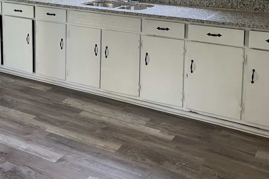 Luxury vinyl plank in a Columbus kitchen with white shaker cabinets