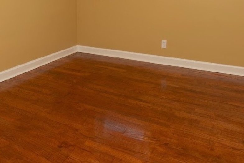 Hardwood floor with fresh finish in an empty Columbus room